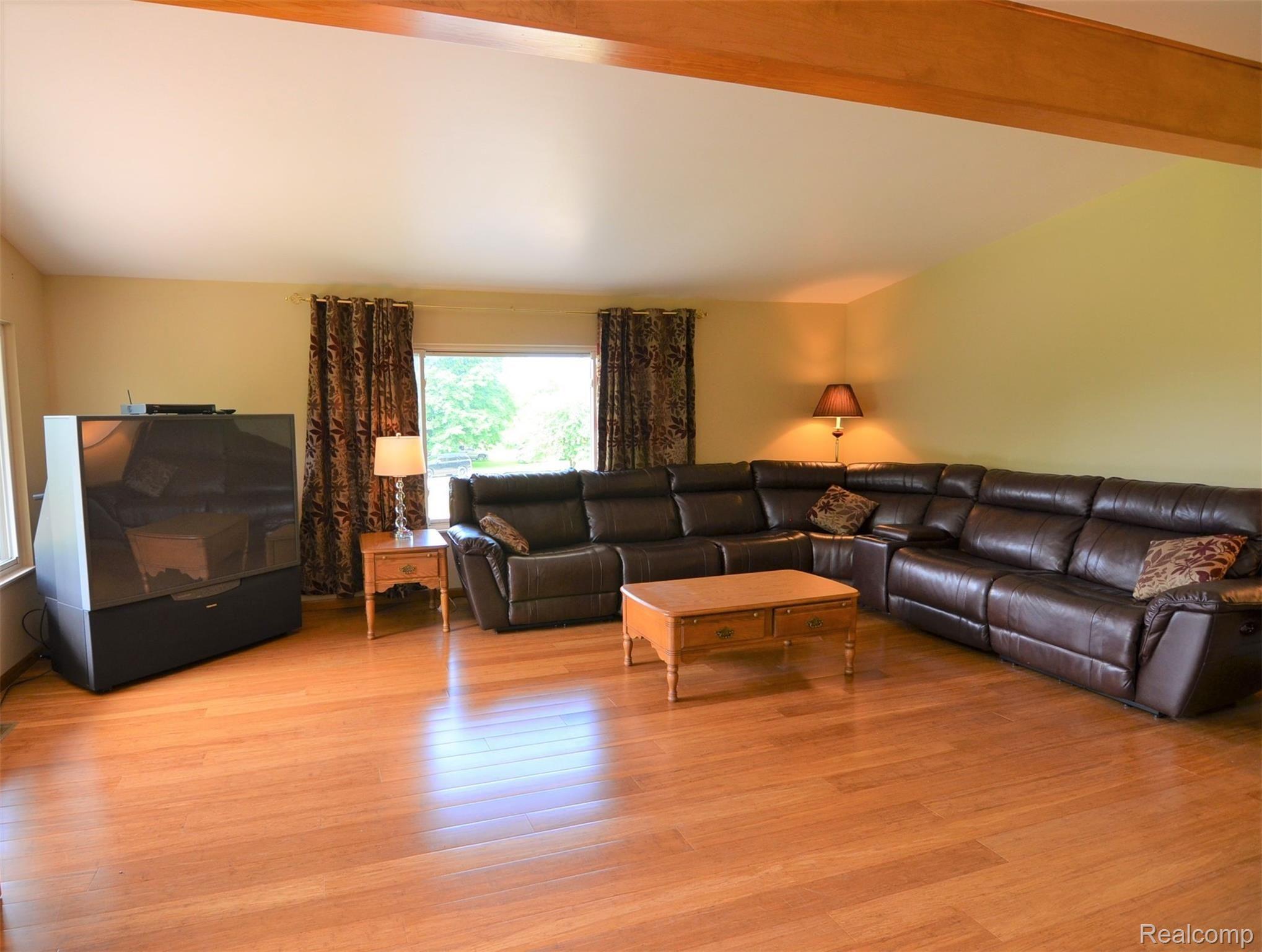 8388 Buckell Lake Road Holly, MI 48442 - Photo 10 of 22 VAULTED~HEARTHED GATHERING ROOM