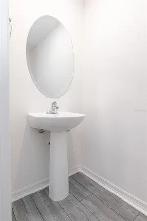 a white toilet sitting next to a white toilet