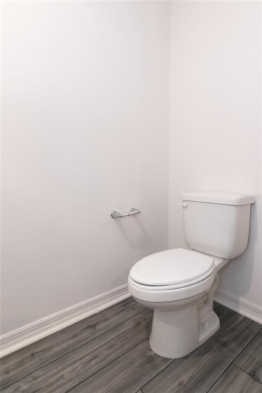 1668 Wynford Circle Tavares, FL 32778 - Photo 14 of 30 a white toilet sitting next to a white toilet