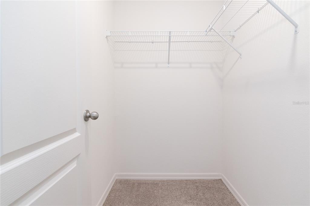 1668 Wynford Circle Tavares, FL 32778 - Photo 21 of 30 a view of small space with racks on the wall