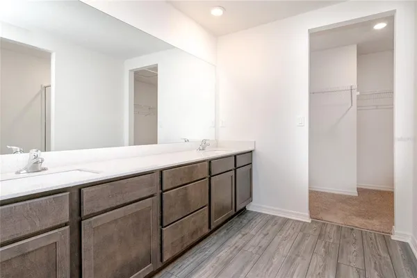 a bathroom with a granite countertop shower