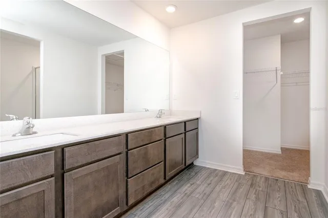 a bathroom with a granite countertop shower