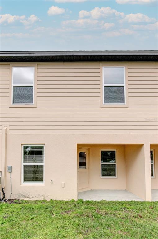 1668 Wynford Circle Tavares, FL 32778 - Photo 28 of 30 a view of a backyard of the house