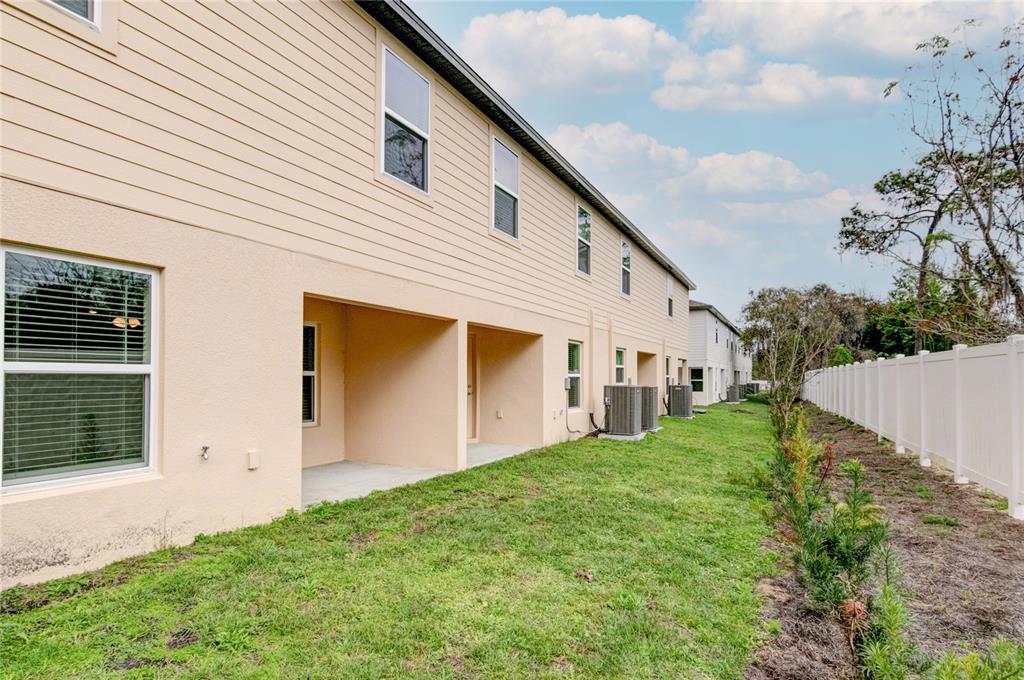 1668 Wynford Circle Tavares, FL 32778 - Photo 29 of 30 a view of backyard with garden