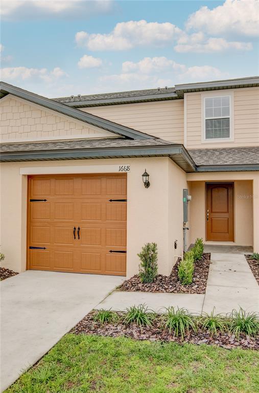 1668 Wynford Circle Tavares, FL 32778 - Photo 3 of 30 a front view of house