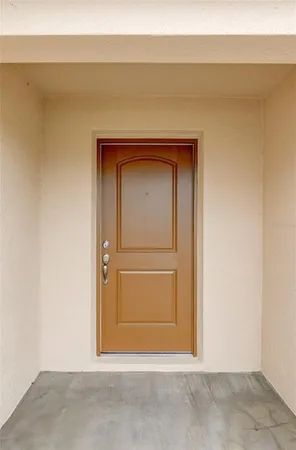 an empty room with wooden floor