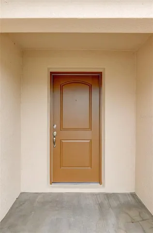 an empty room with wooden floor