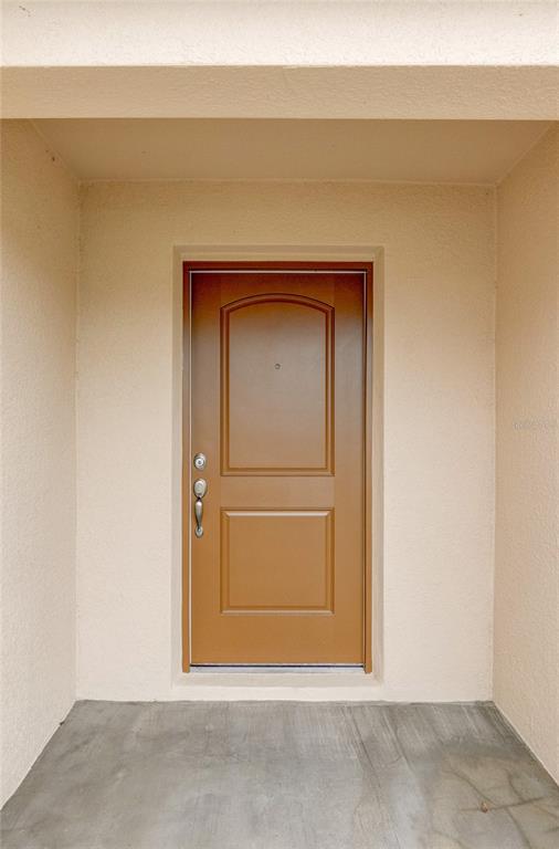 1668 Wynford Circle Tavares, FL 32778 - Photo 4 of 30 a view of wooden door