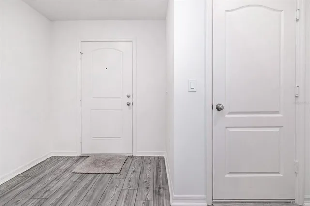 a kitchen with stainless steel appliances granite countertop a refrigerator stove a sink and a microwave