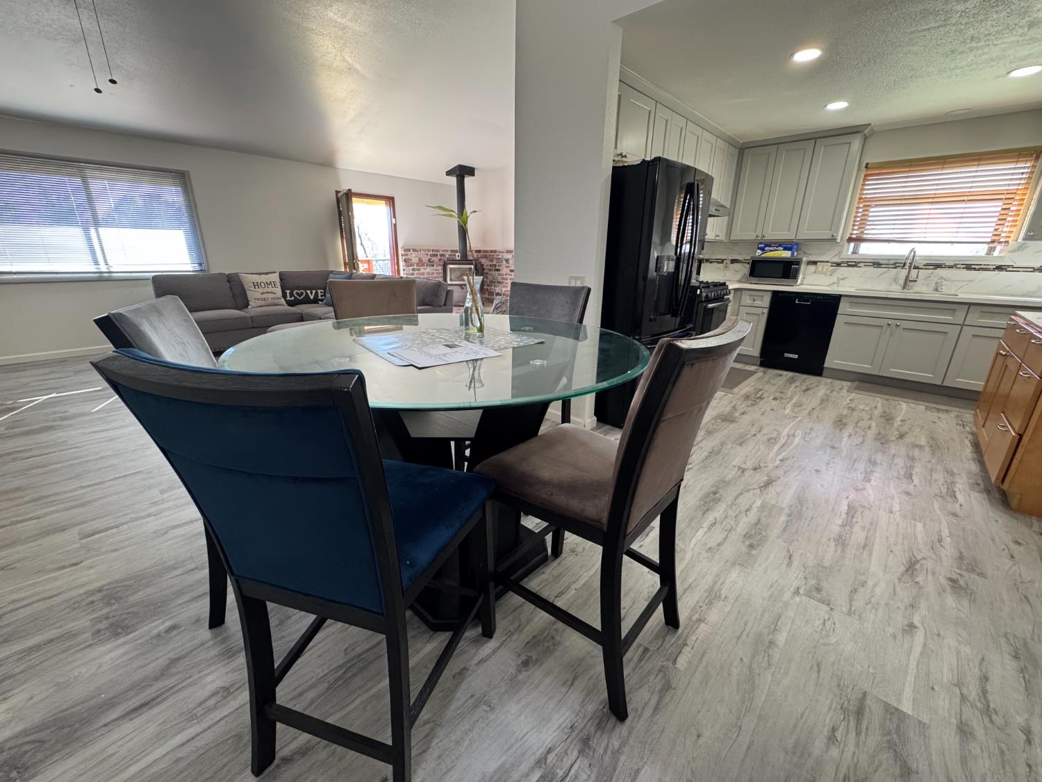 1420 Mt Ida Road Oroville, CA 95966 - Photo 11 of 37 a kitchen with a dining table chairs and refrigerator