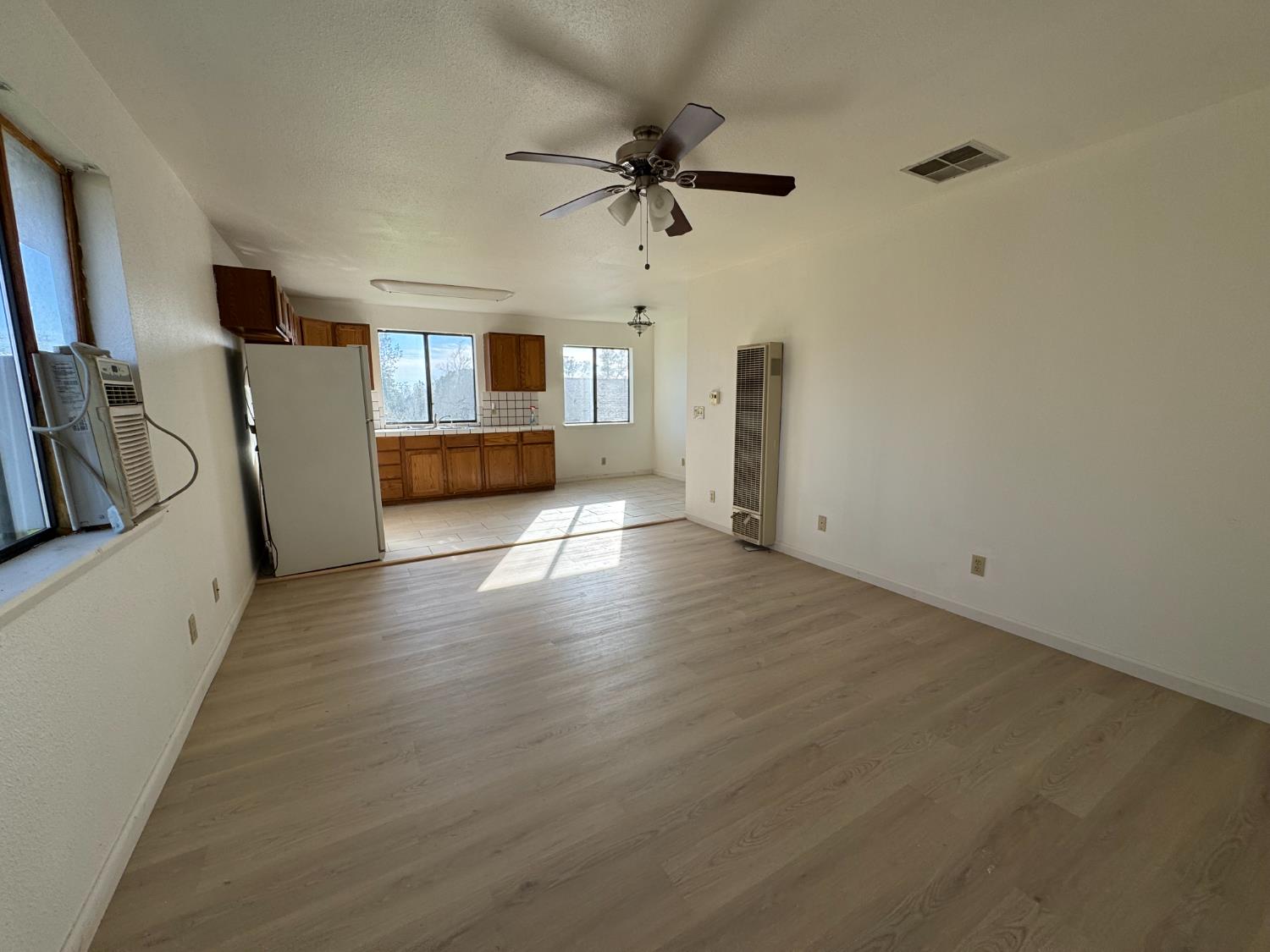 1420 Mt Ida Road Oroville, CA 95966 - Photo 23 of 37 wooden floor in an empty room with a window