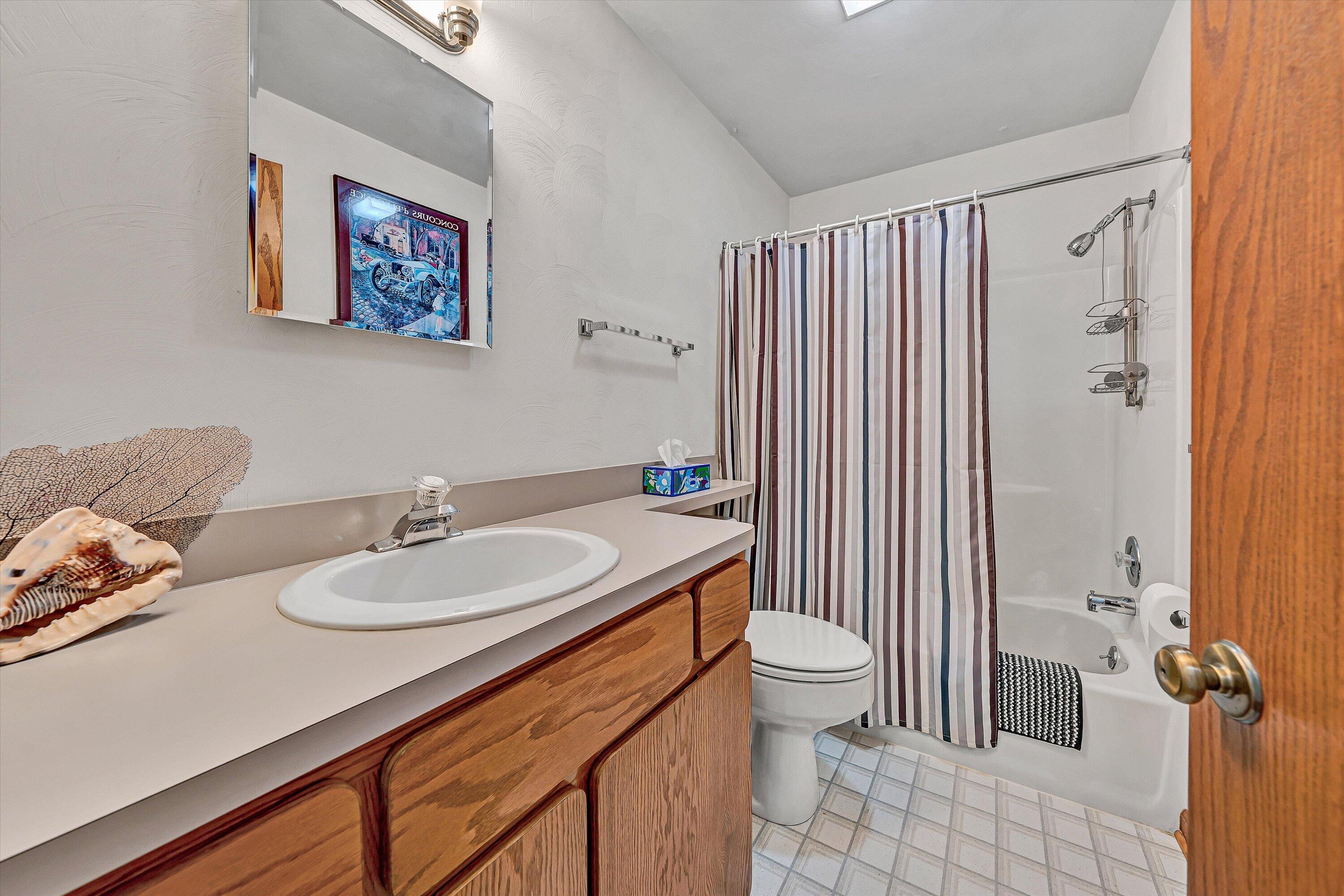 1124 Old Hollow Road Buchanan, VA 24066 - Photo 26 of 73 a bathroom with a granite countertop sink a toilet and a mirror