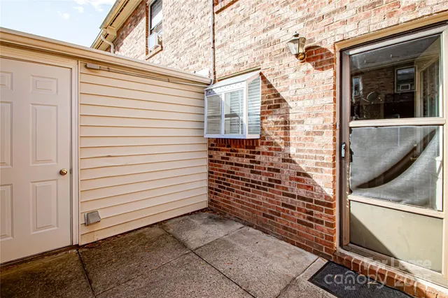 a view of a door and a window