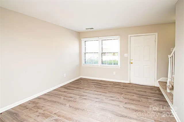 a view of an empty room with a window