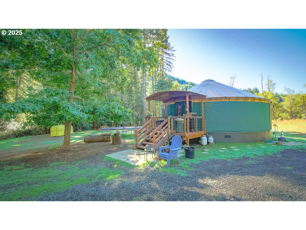 63450 Fairview Road Coquille, OR 97423 - Photo 14 of 37 a black and white house with a yard