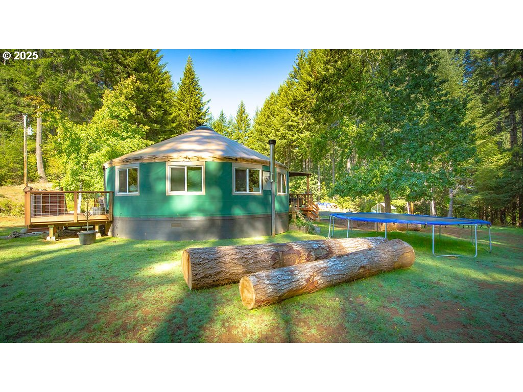 63450 Fairview Road Coquille, OR 97423 - Photo 15 of 37 a view of a house with a swimming pool