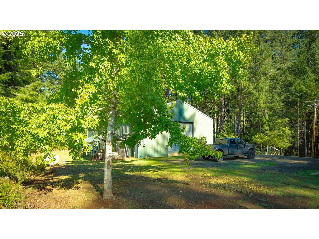 63450 Fairview Road Coquille, OR 97423 - Photo 19 of 37 a view of a house with a yard