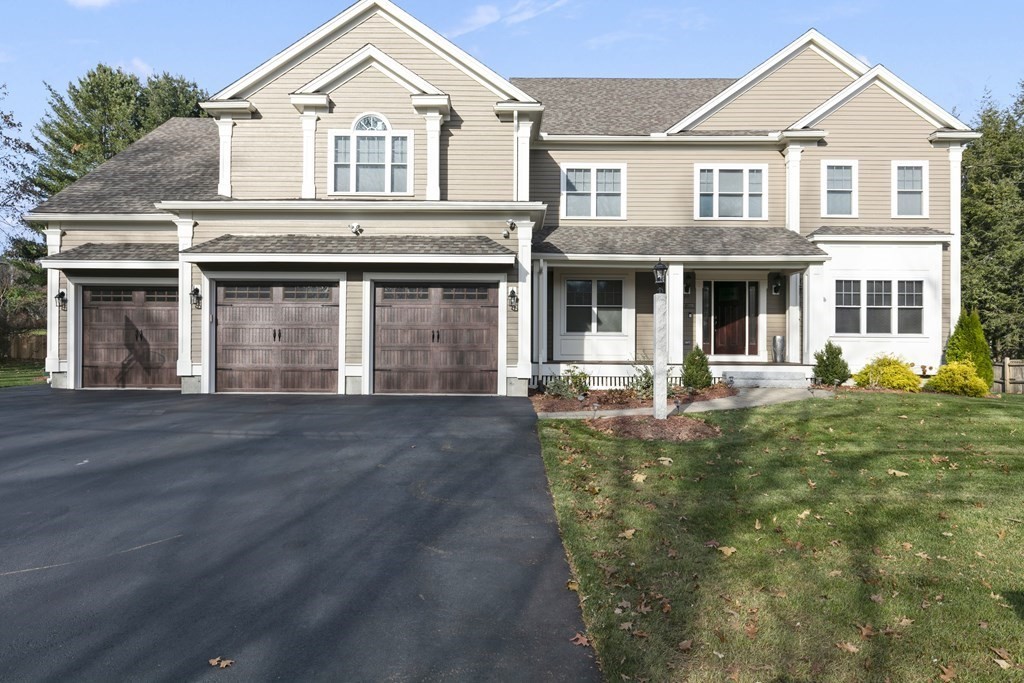 27 Webster Road Lexington, MA 02421 - Photo 1 of 42 a front view of a house with yard and green space