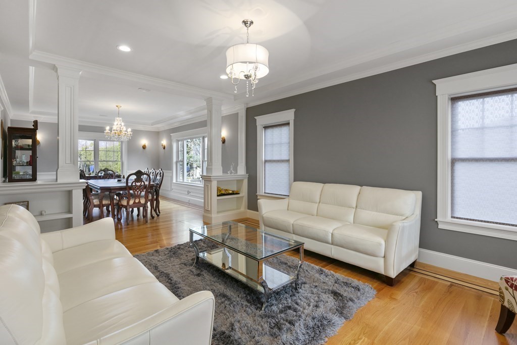 27 Webster Road Lexington, MA 02421 - Photo 12 of 42 a living room with furniture and a chandelier