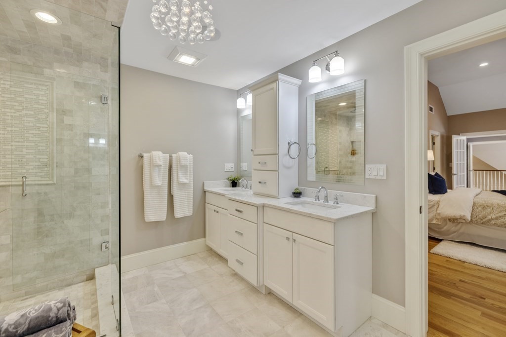 27 Webster Road Lexington, MA 02421 - Photo 23 of 42 a spacious bathroom with a shower sink and mirror