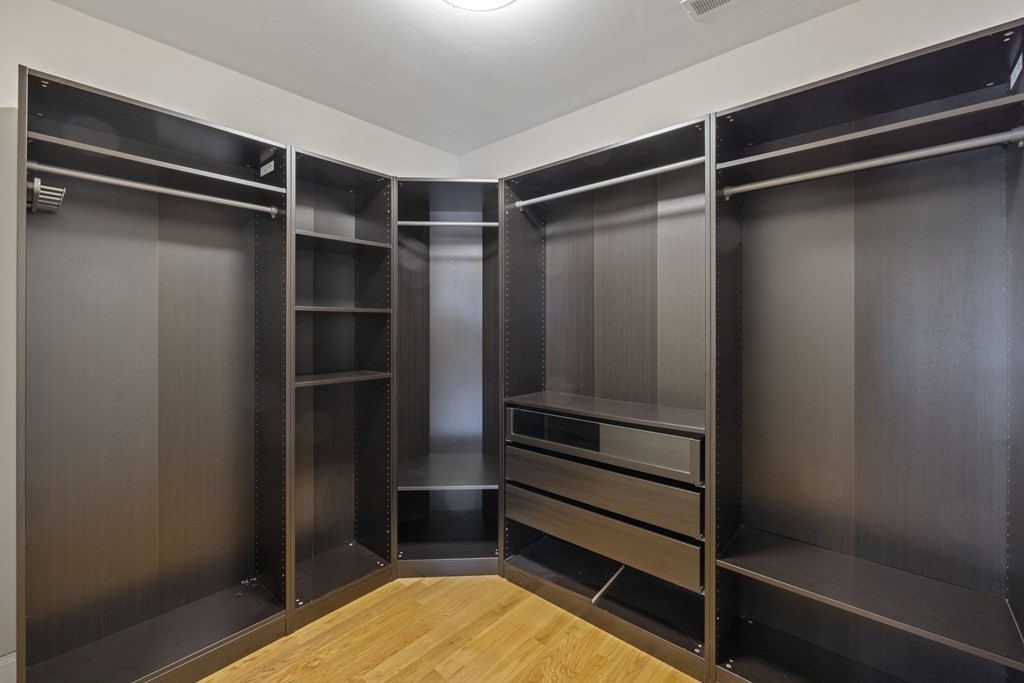 27 Webster Road Lexington, MA 02421 - Photo 26 of 42 a view of walk in closet with empty racks