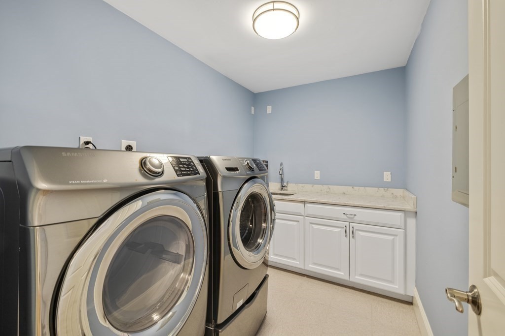 27 Webster Road Lexington, MA 02421 - Photo 33 of 42 a utility room with dryer and washer