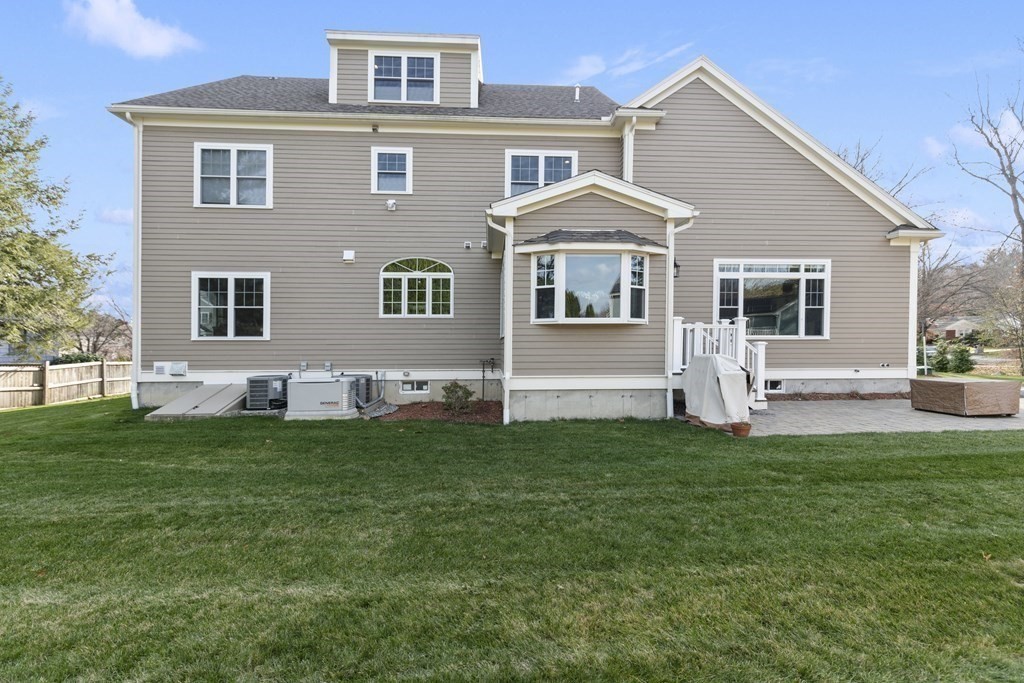 27 Webster Road Lexington, MA 02421 - Photo 41 of 42 a front view of a house with a yard