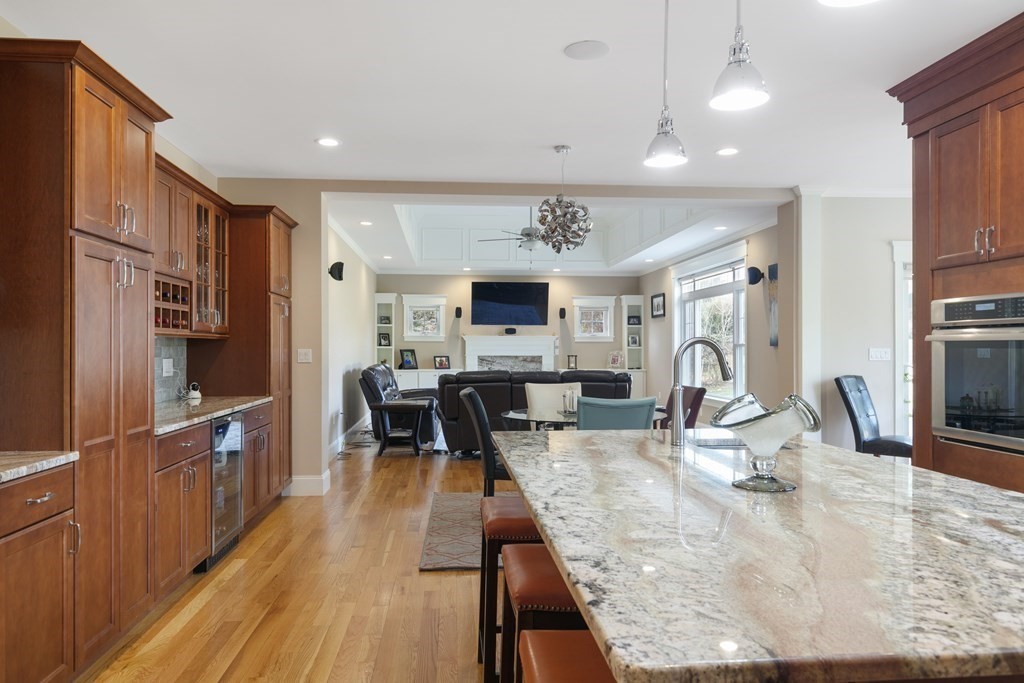 27 Webster Road Lexington, MA 02421 - Photo 6 of 42 a view of a kitchen with kitchen island granite countertop a large counter top and stainless steel appliances