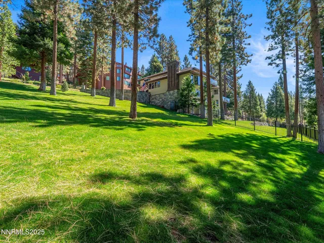 a dining room with furniture a rug and wooden floor
