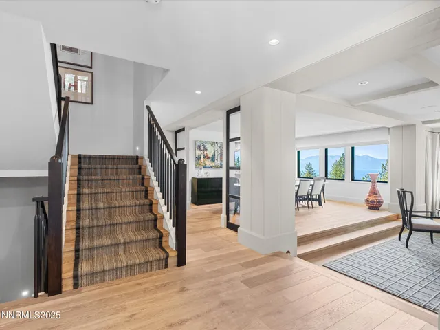 a bedroom with a large bed and a large window