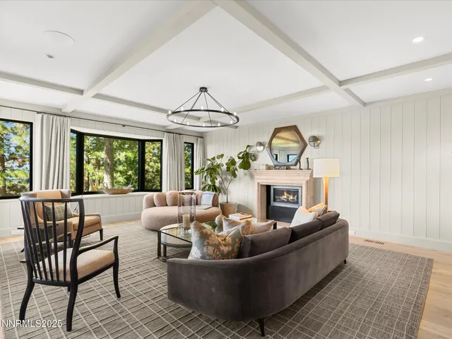 a bed room with a bed and a large window