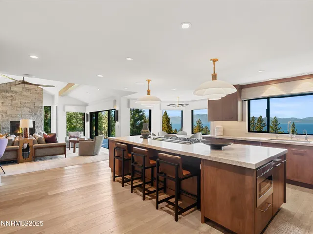 a living room with table chairs and a flat screen tv