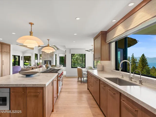 a living room with furniture and a painting on the wall