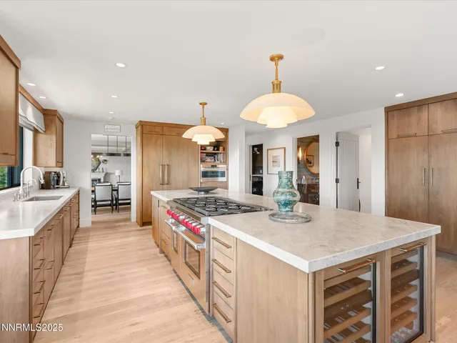 a spacious bedroom with a bed and a flat screen tv