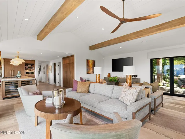 a living room with furniture a window and a dining table
