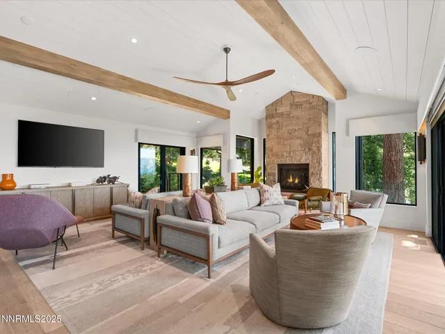 a spacious bathroom with a granite countertop sink and a mirror