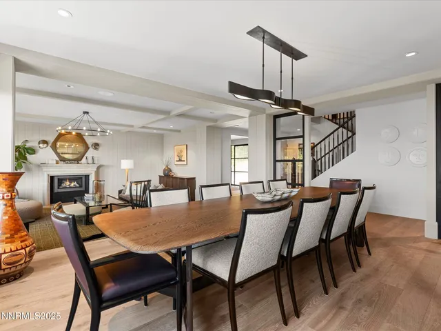 a view of staircase with railing and a chandelier