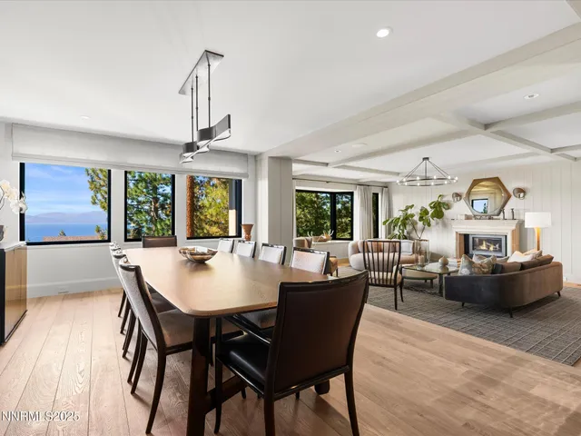 a living room with a flat screen tv and a large window