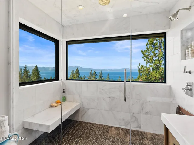 a view of a table and chairs under an umbrella