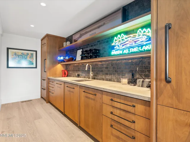 a front view of a house with a yard table and chairs