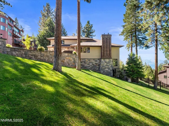 a living room with fireplace furniture and a wooden floor