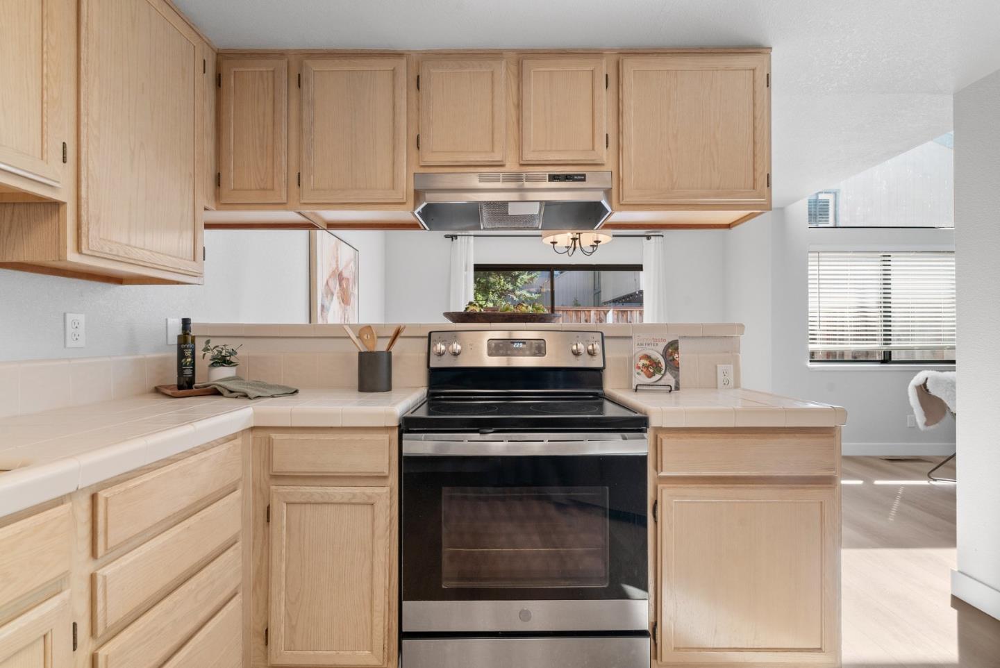355 Village Creek Road Aptos, CA 95003 - Photo 12 of 41 a kitchen with cabinets appliances a sink and a counter top