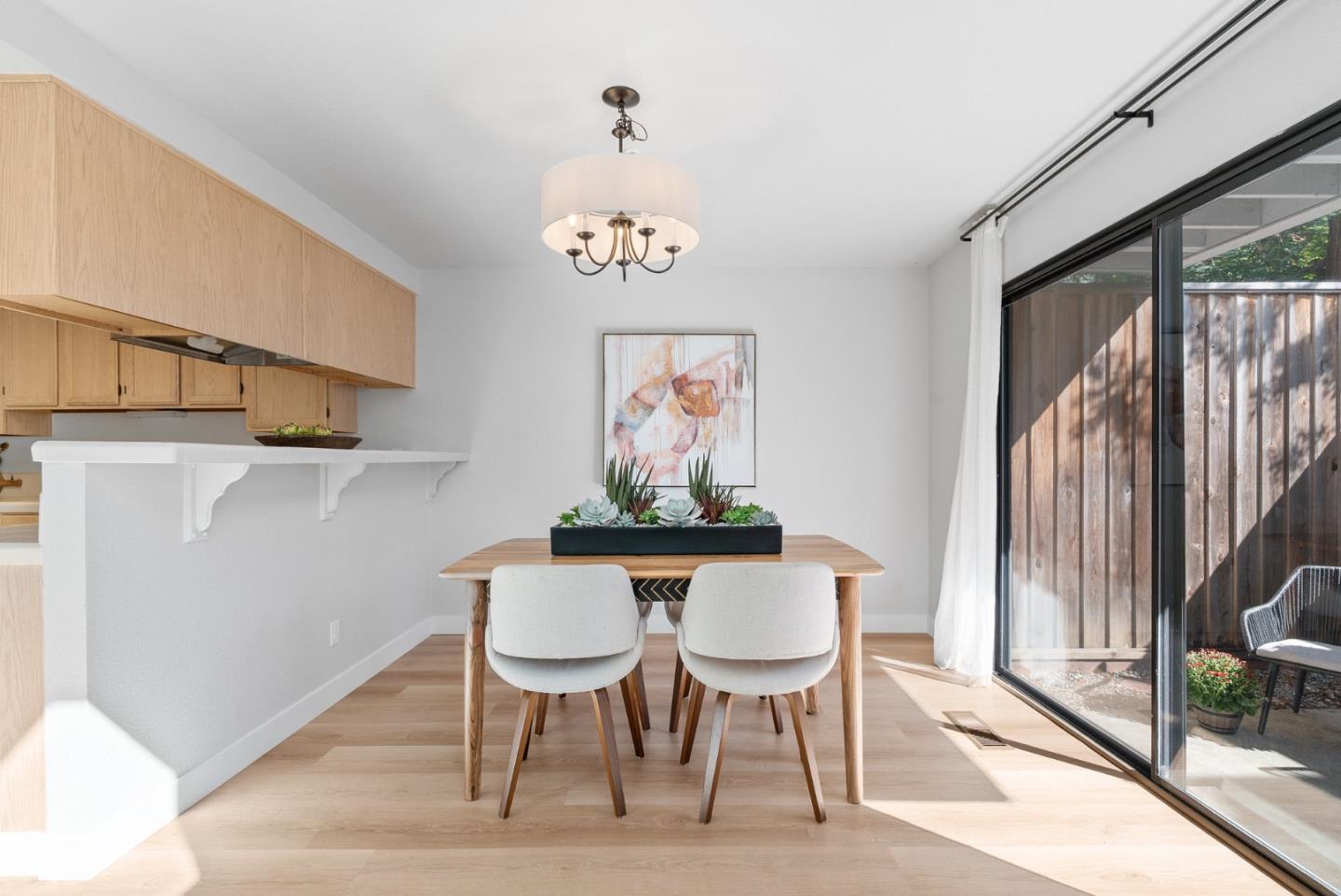 355 Village Creek Road Aptos, CA 95003 - Photo 6 of 41 a view of a dining room with furniture wooden floor and a floor to ceiling window