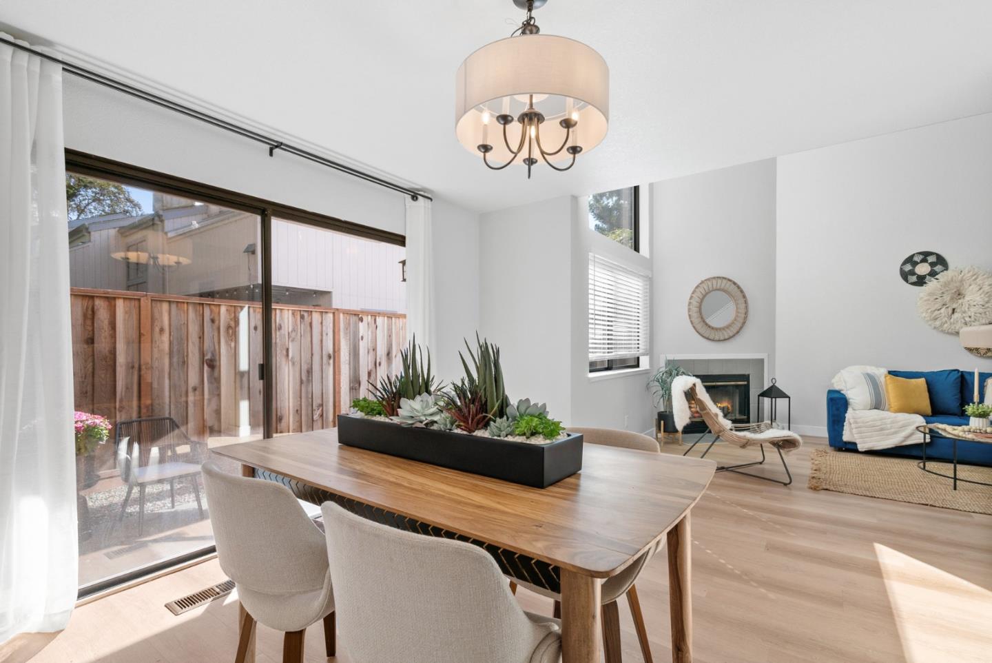355 Village Creek Road Aptos, CA 95003 - Photo 10 of 41 a view of a dining room with furniture a chandelier and a large window