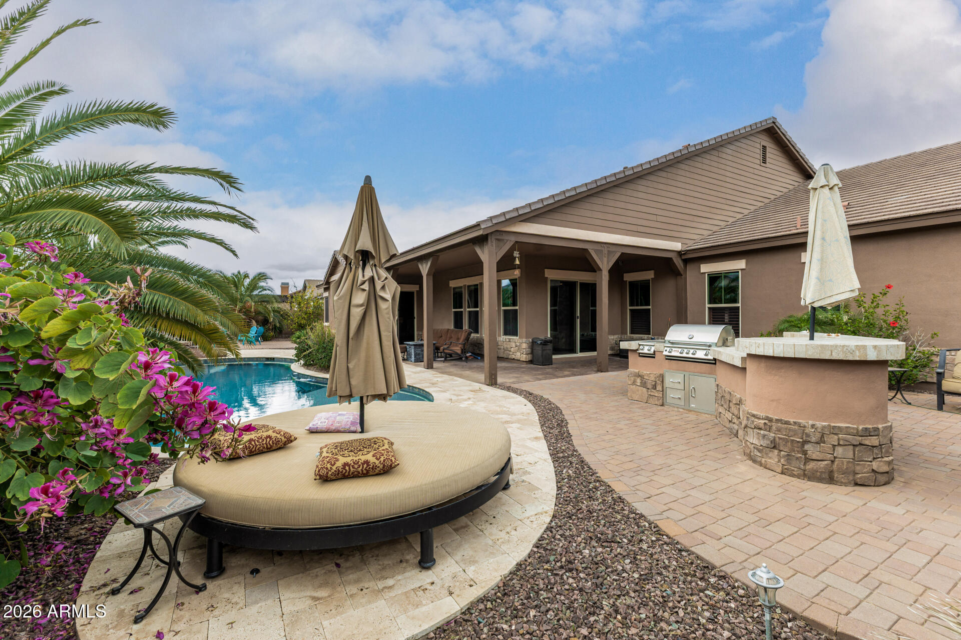 3139 East Harwell Road Phoenix, AZ 85042 - Photo 40 of 45 a view of a patio with table and chairs potted plants