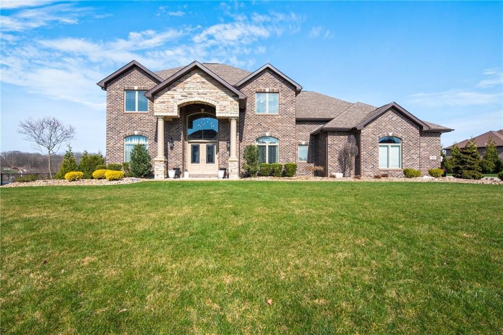 7372 Sierra Drive Irwin, PA 15642 - Photo 1 of 32 a front view of a house with a yard and garage