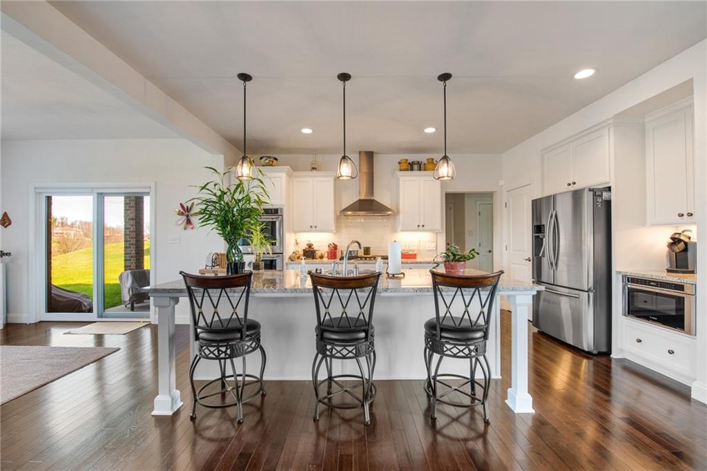 7372 Sierra Drive Irwin, PA 15642 - Photo 11 of 32 a view of a dining room with furniture window and wooden floor