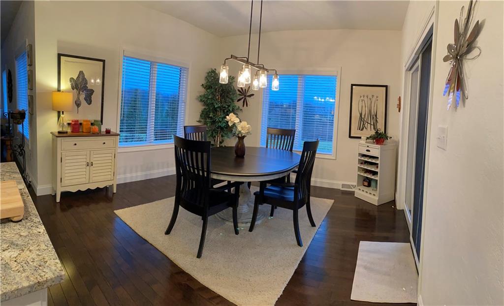 7372 Sierra Drive Irwin, PA 15642 - Photo 13 of 32 a view of a dining room with furniture and wooden floor
