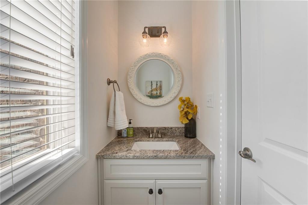 7372 Sierra Drive Irwin, PA 15642 - Photo 18 of 32 a bathroom with a granite countertop sink and a mirror