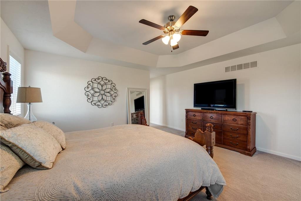 7372 Sierra Drive Irwin, PA 15642 - Photo 21 of 32 a bedroom with a large bed and a flat screen tv